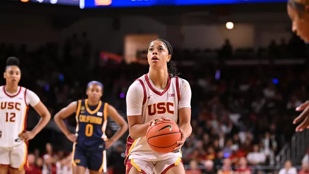Saniyah Hall shooting on court.