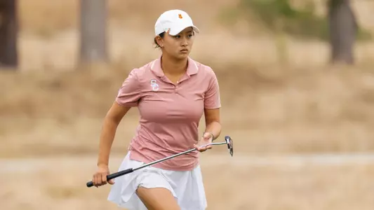 Elise Lee carries her putter at the 2026 NCAA Championships