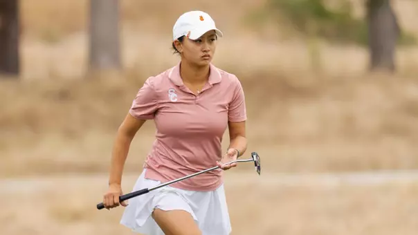 Elise Lee carries her putter at the 2026 NCAA Championships