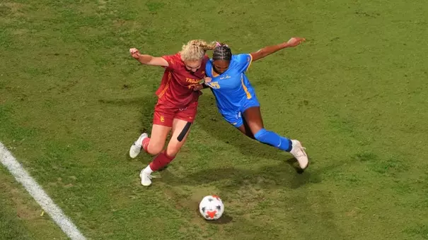 Amalie Pianim fights for the ball with a UCLA player at Rawlinson Stadium.