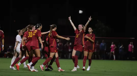 Eleanor scores against Illinois and celebrates with the team on Thursday night