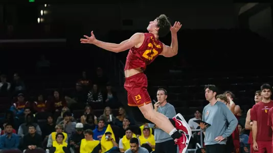 USC men's volleyball freshman outside hitter Cooper Keane goes up to serve a ball against UC Irvine at Galen Center