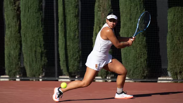 Dani Borruel prepares to hit a shot on the tennis court while holding her racquet