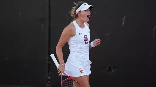 USC Women's Tennis player Immi Haddad celebrates after winning a point in exclamation.