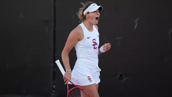 USC Women's Tennis player Immi Haddad celebrates after winning a point in exclamation.