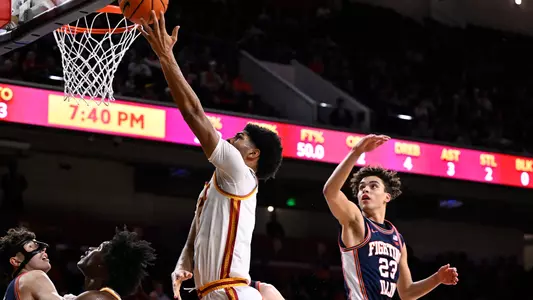 Jacob Cofie goes for a layup against Illinois