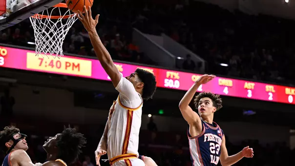 Jacob Cofie goes for a layup against Illinois