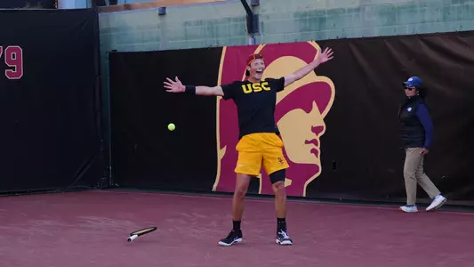 Niels Hoffmann celebrates on court after beating UCLA men's tennis