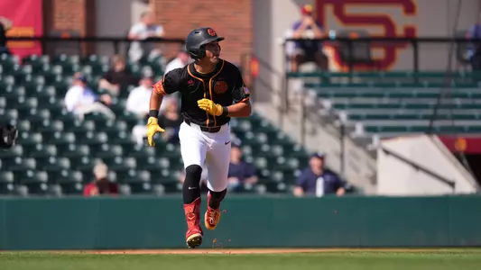 Augie Lopez hits a home run and jogs around the bases in the final game against Rice.