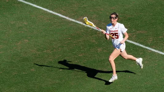 USC lacrosse senior midfielder Casey Roberts brings the ball across the field during a game at Rawlinson Stadium