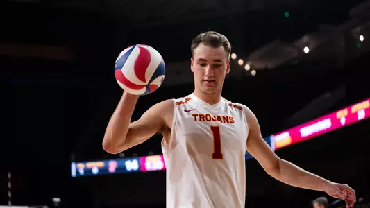 USC men's volleyball outside hitter Dillon Klein collect the ball to go back and serve during a match at Galen Center