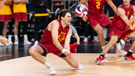 USC men's volleyball outside hitter Sterling Foley digs a ball in a match against UCLA at Galen Center