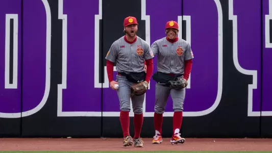 Andrew Lamb celebrates after a catch at the wall against Northwestern on the road.