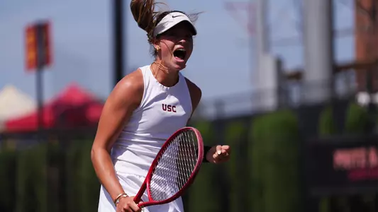 Immi Haddad celebrates as she wins a point on court.