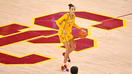 Jazzy Davidson brings a ball down the court for the Trojans.