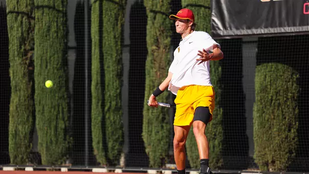 Niels Hoffmann hits the ball on tennis court