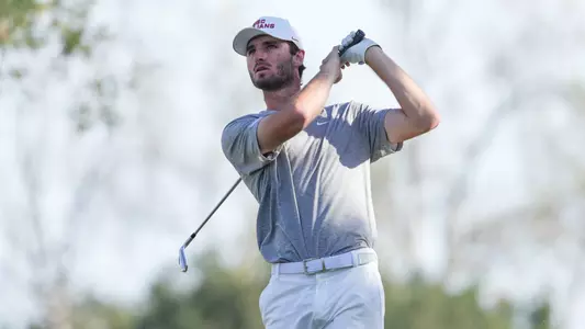 Luke Stock swings an iron at the Southwestern Invitational