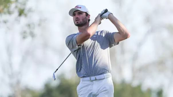 Luke Stock swings an iron at the Southwestern Invitational