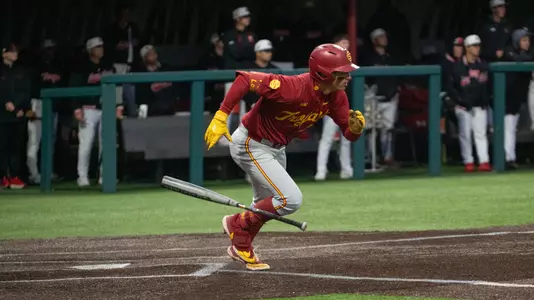 Augie Lopez hustles down the line after an infield hit in the first game against the Maryland Terrapins.