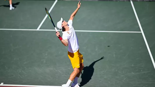 Men's Tennis Player prepares for a serve