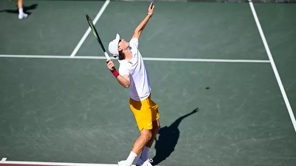 Men's Tennis Player prepares for a serve