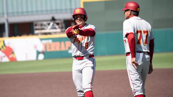 Kevin Takeuchi celebrates on base as he gets his first hit of the series against Maryland.