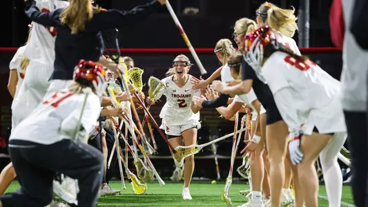 USC senior lacrosse captain Kate Gerrity runs out during team introductions at Rawlinson Stadium