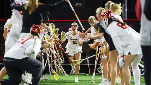 USC senior lacrosse captain Kate Gerrity runs out during team introductions at Rawlinson Stadium