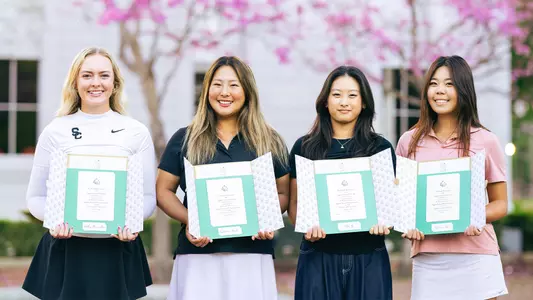 Bailey Shoemaker, Catherine Park, Elise Lee and Jasmine Koo pose with their ANWA acceptance letters