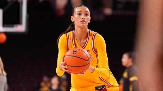 Jazzy prepares to shoot a free throw as she holds ball in her hand.