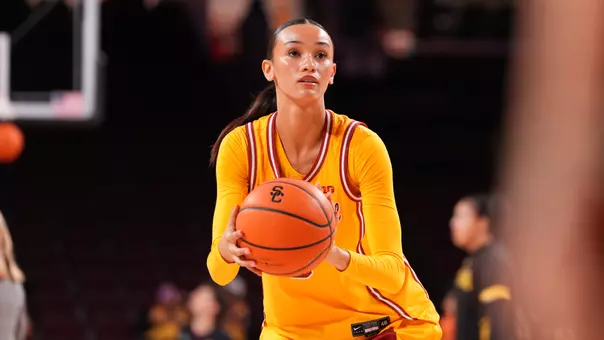 Jazzy prepares to shoot a free throw as she holds ball in her hand.