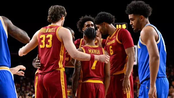USC Men's Basketball huddles together against UCLA