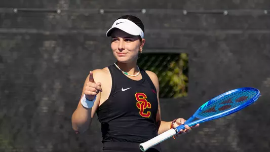 Eugenia Zozaya points her finger to indicate a ball being out