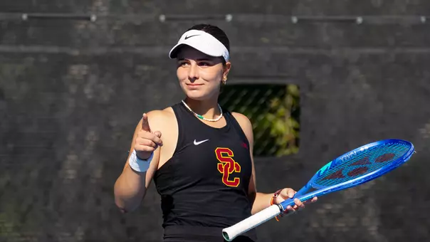 Eugenia Zozaya points her finger to indicate a ball being out