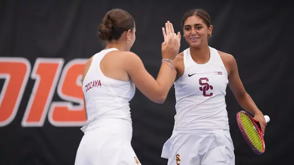 Jana Hossam and Eugenia Zozaya high five after a win