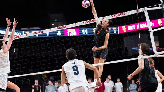 USC men's volleyball outside hitter Dillon Klein attacks from the back row during a match against Menlo at Galen Center