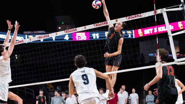 USC men's volleyball outside hitter Dillon Klein attacks from the back row during a match against Menlo at Galen Center