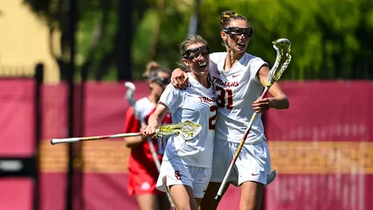 USC lacrosse defenders Kate Gerrity and Sophie Gangemi celebrate during a game against Ohio State at Rawlinson Stadium