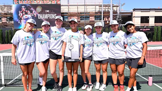 USC women's tennis poses for a photo with big ten trophy