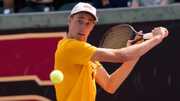 Branko Djuric hits a slicer with his tennis racket.