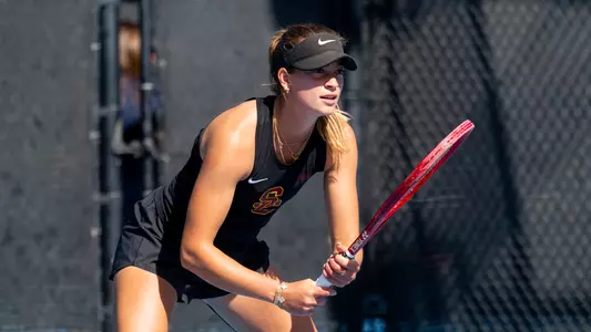 immi haddad squats and prepares for a serve