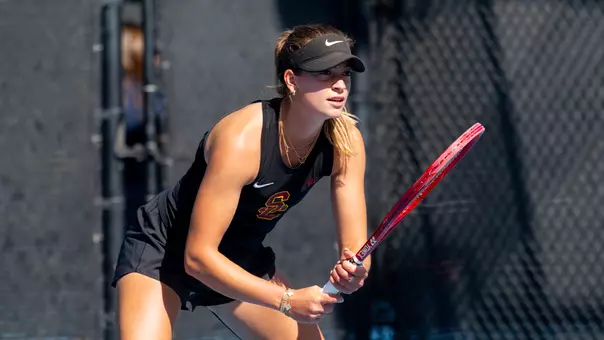 immi haddad squats and prepares for a serve