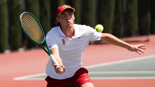 nathan trouve hits a tennis ball using racket