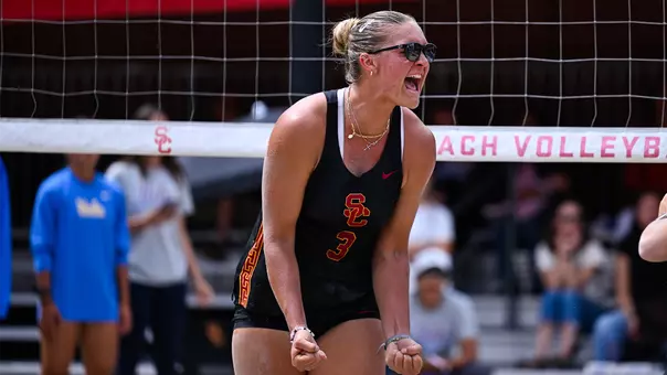 Kennedy Coakley cheers after scoring a point against UCLA