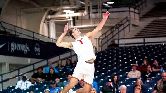USC men's volleyball outside hitter Dillon Klein goes up to serve in a match against Vanguard at Smith Fieldhouse in Provo, Utah