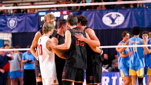 USC men's volleyball team huddles on the court at Smith Fieldhouse in Provo, Utah, during the MPSF championship match