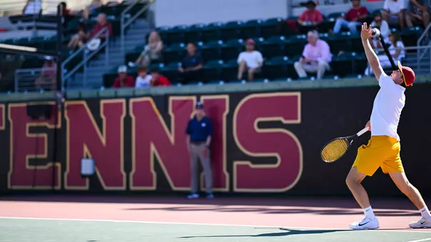andrin casanova prepares a serve