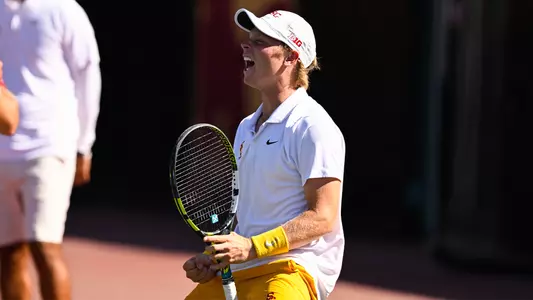 Max exited celebrates with a scream on the tennis court