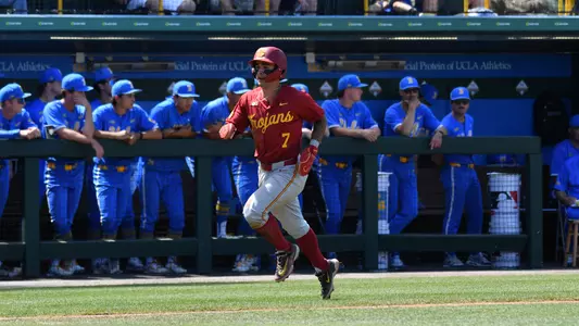Abbrie Covarrubias scoring a run in second game against UCLA