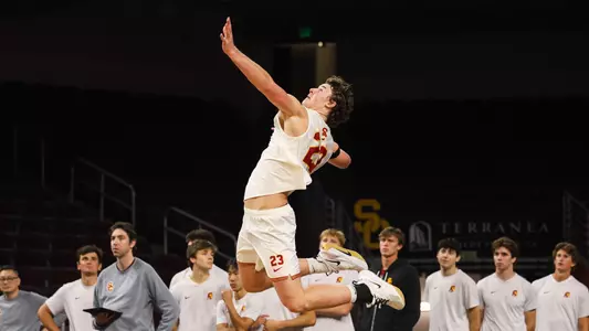 USC men's volleyball opposite hitter Cooper Keane goes up to serve a ball during a match against Stanford at Galen Center